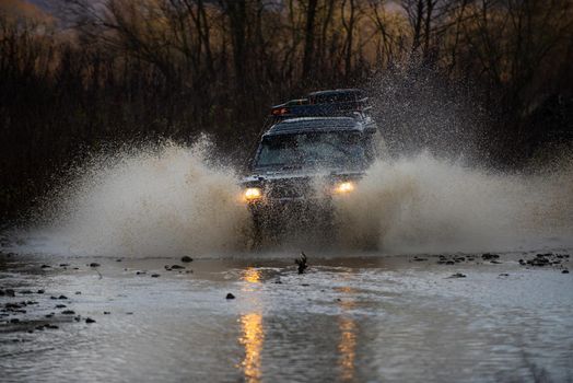 4x4 travel trekking. Crashed into a puddle and picked up a spray of dirt. Outdoors adventures. Beautiful nature. Best Off Road Vehicles. Rally racing. Safari suv. Off road. Off-road travel on mountain road