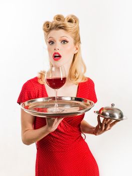 Happy girl with glass of wine. Red lips. Woman studio photography. Beauty. Happy excited woman in retro dress with beautiful hairdo. Fashion