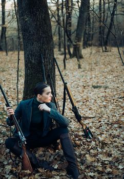 hunting nature environment. military fashion. achievements of goals. successful hunt. hunting sport. woman with weapon. Target shot. girl with rifle. chase hunting. Gun shop. female hunter in forest.