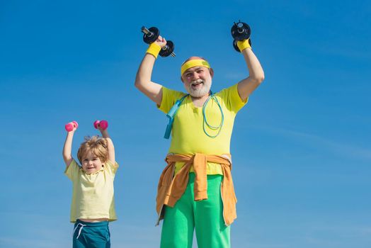 Grandfather and son doing exercises. Father and children having workout. Senior man and child in family health club. Sports for kids