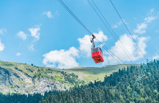 Old waggon moves along cable car in sunny weather