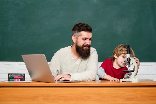 Chalkboard background. First day in school. Chalkboard ready for text. Homeschooling. Elementary school. Copy space. Teacher and child. Young or adult