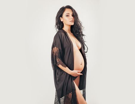 Maternity preparation. future mother have baby inside. womens health. girl with big belly. life birth expectation. beautiful pregnant woman in silk underwear. pregnancy. She is going to be a mom soon.