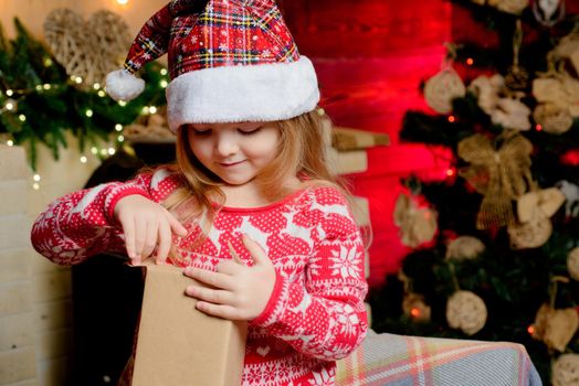 Present box. Gift. Girl in new year clothes. Christmas eve. Celebrate christmas. . Happy new year