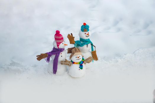 Winter Sale banner. Snowman - parent and snowman kid - winter concept. Cute snowmen family standing in winter Christmas landscape