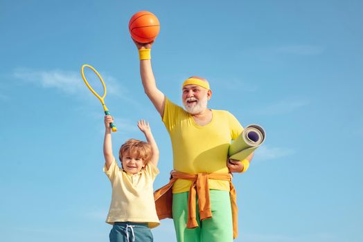 Family sport. Healthcare cheerful lifestyle. Sports for kids. Grandfather and child do morning exercise. Body care and healthcare