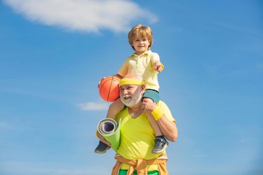 Family sport. Healthcare cheerful lifestyle. Sports for kids. Grandfather and child do morning exercise. Body care and healthcare