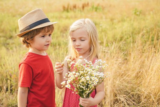 Kids play in autumn park. Children outdoor fun in autumn. Toddler kids or preschooler child in fall