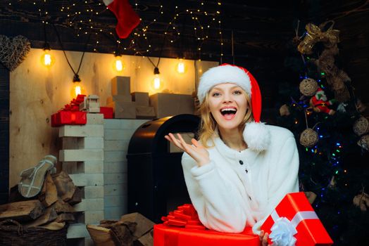 Smiling woman decorating Christmas tree at home. Friendly and joy. Give a wink. Christmas woman. Young woman wink. New year gift. Happy new year. Funny christmas girl