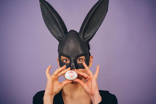 Lips and Easter, Lipstick kiss imprint on easter egg. Easter bunny woman, rabbit and girl. Girl with lace bunny ears