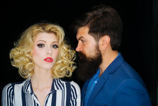 Close up photo of beautiful couple on isolated background. Attractive woman with bearded hipster man