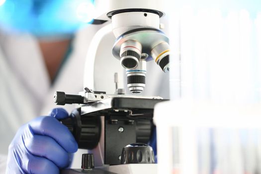 Head microscope on the background laboratory is a study human biology analyzes for non-compliance with the requirements organization public health at international level