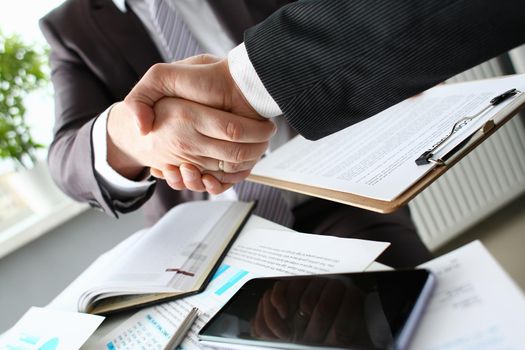 Man in suit shake hand as hello in office closeup. Friend welcome mediation offer positive introduction greet or thanks gesture summit participate approval motivation strike arm bargain concept