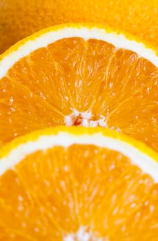 Orange juicy orange divided into slices. Close-up photo
