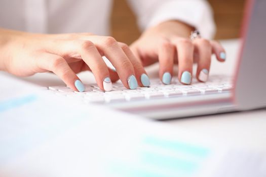Female hands typing on silver keyboard using computer pc at workplace closeup. White collar job, digital shopping office lifestyle search success enter login password and credentials concept