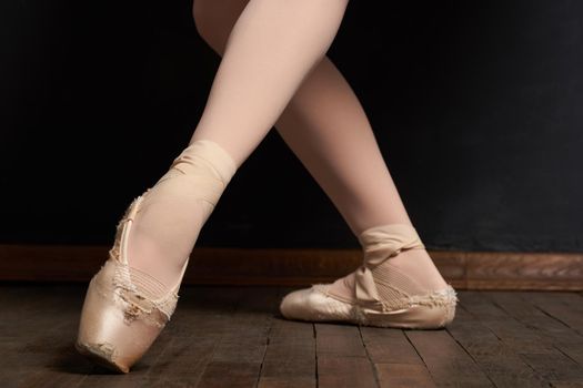 ballerina legs exercise performance classical style close-up. High quality photo