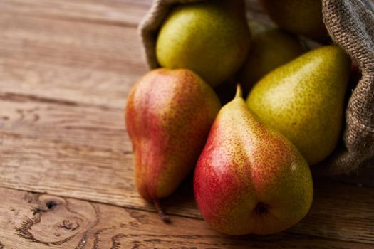 pears on wooden table agriculture vitamins close-up. High quality photo