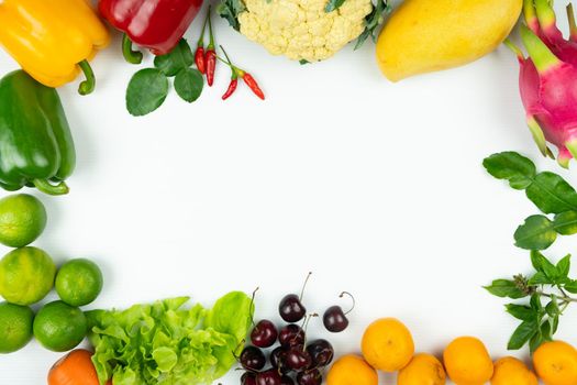 Fresh fruit and vegetable. Frame of fresh raw organic vegetables on white background