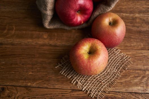 apples on a wooden table vitamins fresh fruits organic. High quality photo