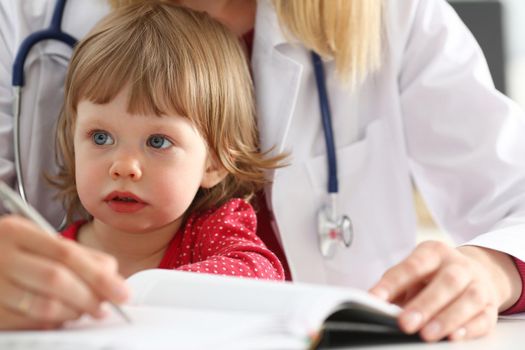 Little child with mother at pediatrician reception. Physical exam, cute infant portrait, baby aid, healthy lifestyle, ward round, child sickness, clinic test, high quality and trust concept