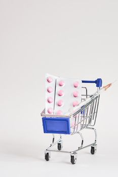 drug trolleys pharmacy shopping light background pharmacy. High quality photo