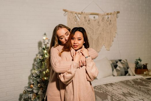 Two young asian women smiling with happiness in Christmas party, lgbt couple, celebration