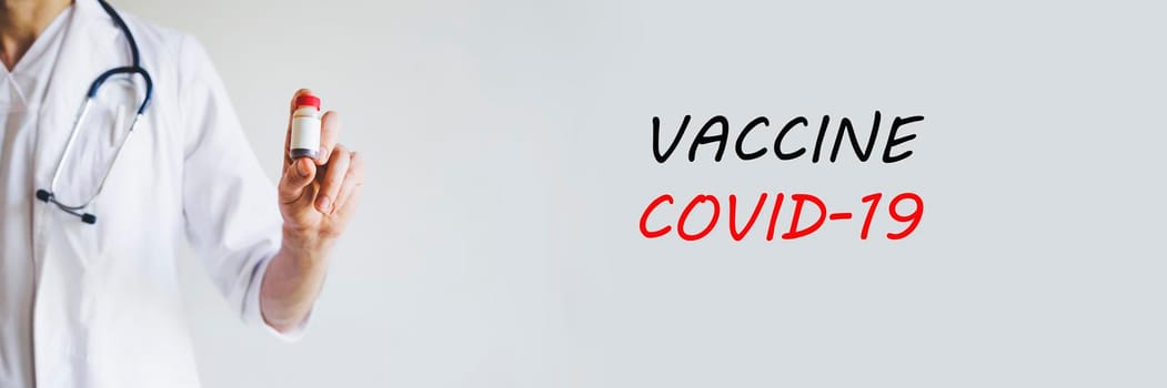 In the hands of a medical officer, the vaccine against the virus. The doctor is on the front line. Coronavirus vaccine. Treatment Covid-19.