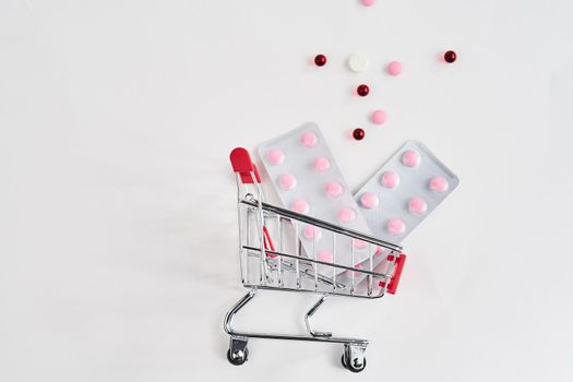 drug trolleys pharmacy shopping light background pharmacy. High quality photo