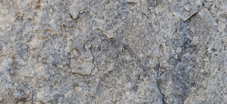 Natural gray stone as a background or texture seamless for design. High quality photo