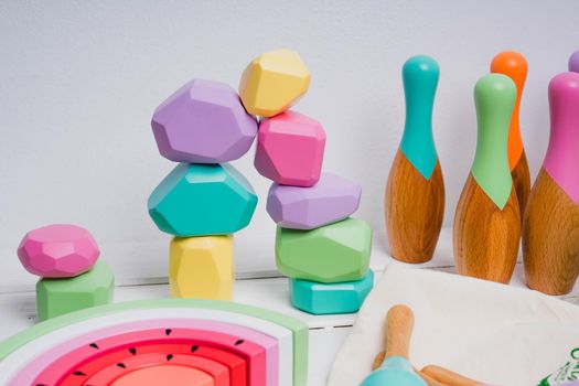 Wooden cubes with different faces for the development of coordination and balancing. Bright toys for children made of natural wood. Zero waste. Safe toys for kids.