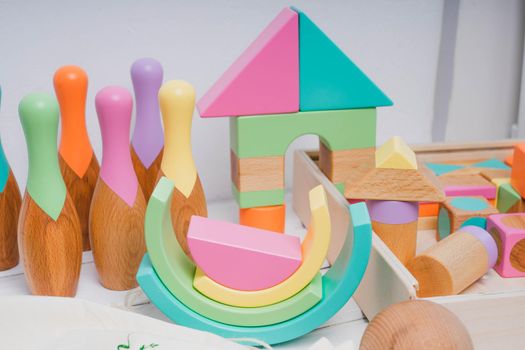 Children's wooden toys in bright colors. Bright toys for children made of natural wood. Safe toys for kids. Zero waste.