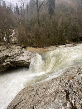 Beautiful landscape of mountain river in amazing and mysterious nature. Mountain waterway flowing through mountainous terrain