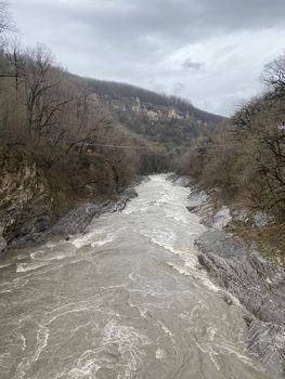 Beautiful landscape of mountain river in amazing and mysterious nature. Mountain waterway flowing through mountainous terrain