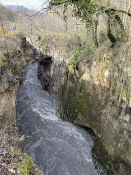 Close up of impressive canyon in spring season. Narrow deep river valley in mountainous terrain