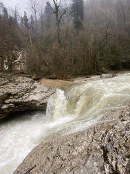 Beautiful landscape of mountain river in amazing and mysterious nature. Mountain waterway flowing through mountainous terrain