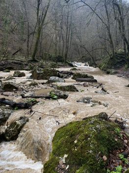 Beautiful landscape of mountain river in amazing and mysterious nature. Mountain waterway flowing through mountainous terrain