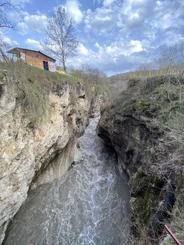 Close up of impressive canyon in spring season. Narrow deep river valley in mountainous terrain