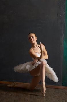 woman ballerina in white tutu performance grace dance. High quality photo