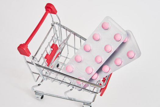 drug trolleys pharmacy shopping light background pharmacy. High quality photo