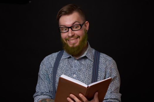 man in glasses with a notebook in his hands training professional office. High quality photo