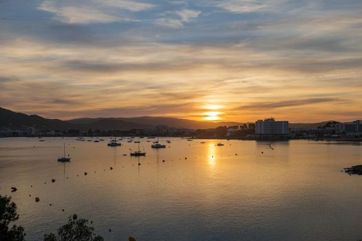 Peaceful harbor for a sail boats in mild sunset light