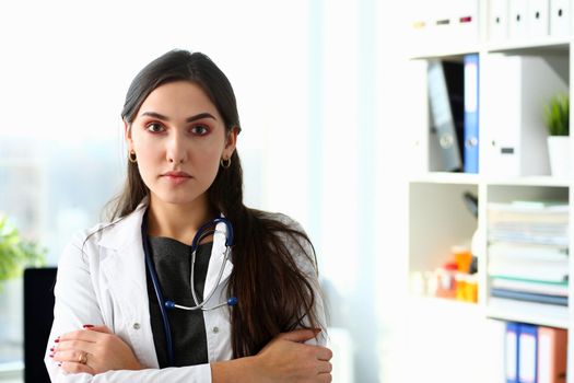 Beautiful smiling female doctor at workplace portrait. Physical and disease prevention patient aid exam visit 911 ward round prescribe remedy healthy lifestyle consultant profession concept