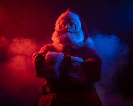 Santa claus in blue red smoke. Party for Christmas