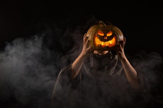 Pumpkin jack o lantern instead of a woman's head. Halloween.