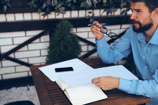 business man summer cafe documents work communication. High quality photo