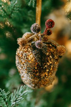 Vintage handmade Christmas tree toy hanging on a Christmas tree, close-up.