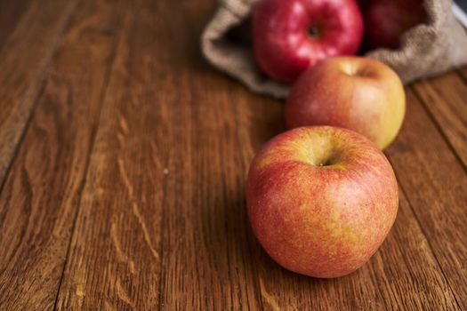 apples on a wooden table vitamins fresh fruits organic. High quality photo