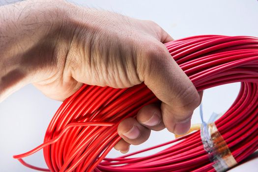 Red cable on a white background