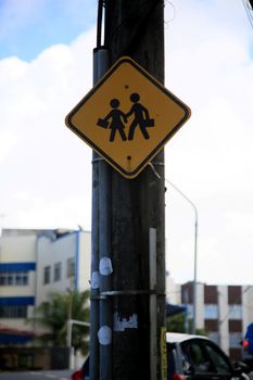 salvador, bahia, brazil - july 20, 2021: traffic sign indicating pedestrian crossing in a school area in the city of Salvador.