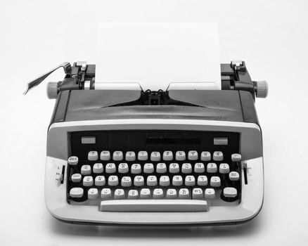 Old typewriter on white background